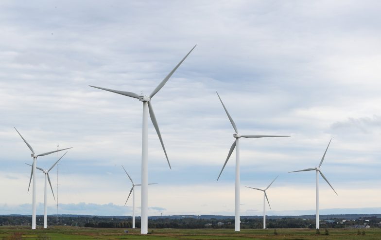 Several windmills in a field