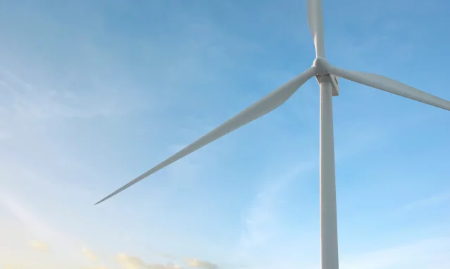 A modern windmill against a blue sky